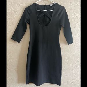 Fitted black cross front dress.